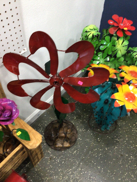 Flower wind spinner on rock